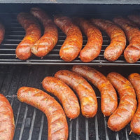 Sausages cooking on a grill