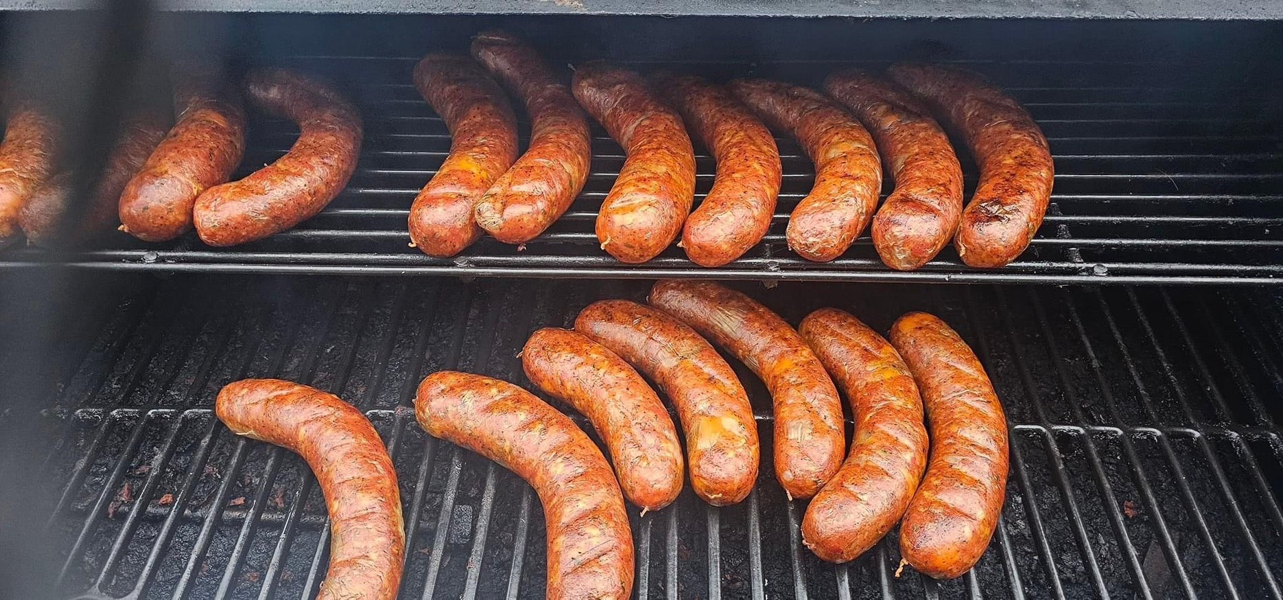 Sausages cooking on a grill